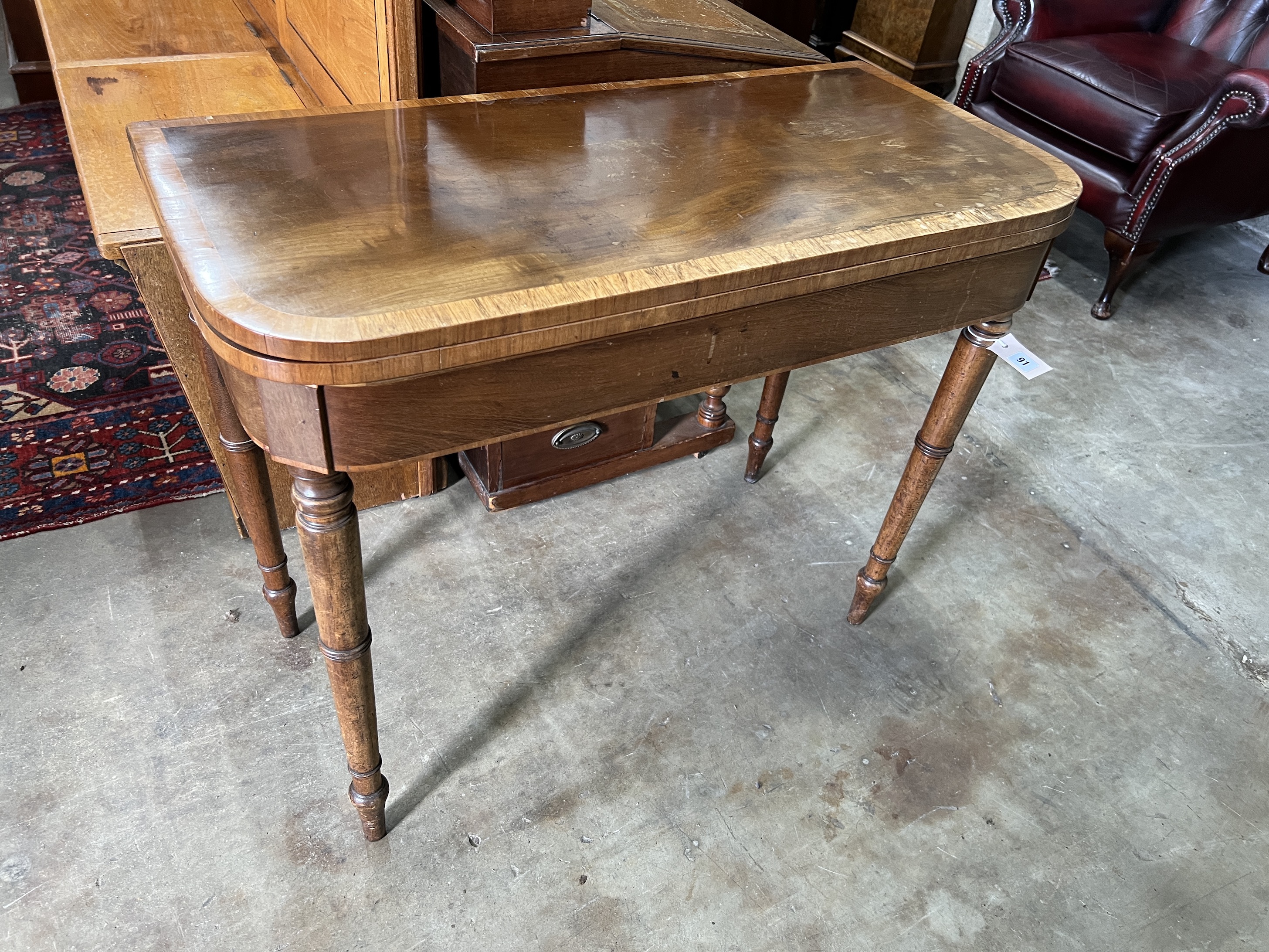 A Regency satinwood banded mahogany folding card table, width 91cm, depth 44cm, height 72cm